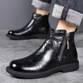 Men's brown and black genuine leather Chelsea boots with side zipper, mesh lining, low heel, and rubber sole.
