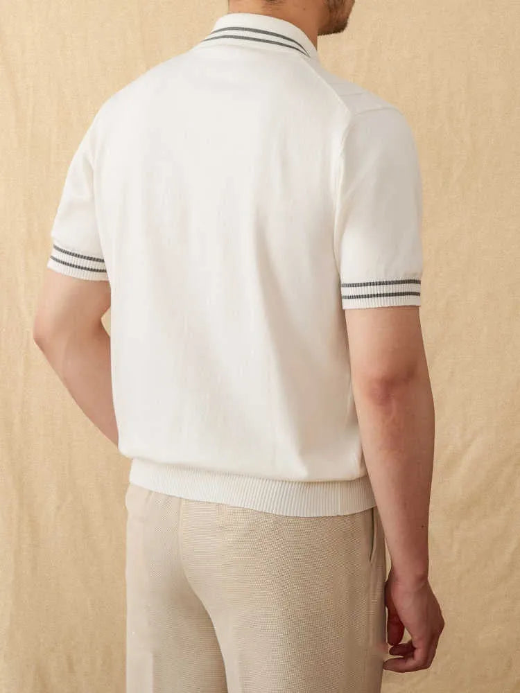 Man wearing a short-sleeved apricot lapel polo shirt made from cotton-polyester blend fabric.