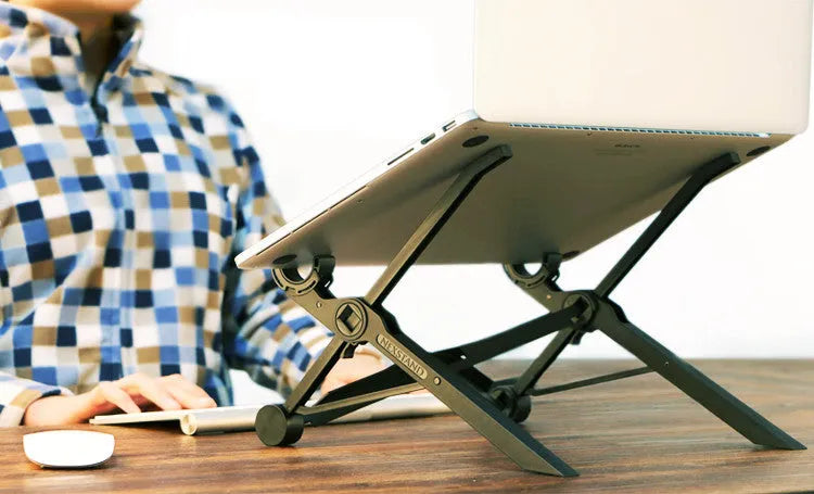 Black folding portable laptop stand made of reinforced nylon, shown open and folded to 4cm depth.