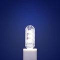 Small white USB-powered LED night light showing warm and white light options