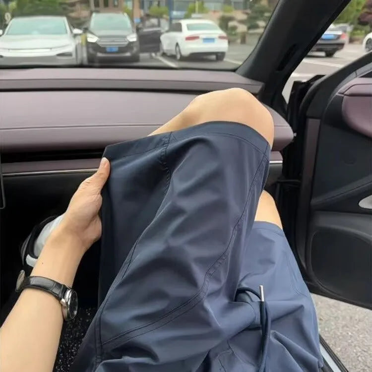 Men's quick-dry polyester sports shorts in straight-leg style with elastic waistband