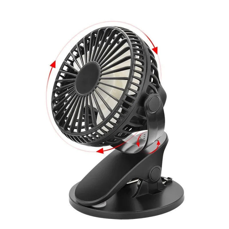 Small white USB clip fan with plastic blades attached to a desk edge, showing piano button switch and brushless motor.