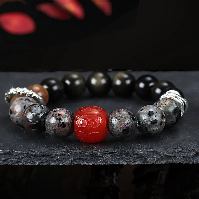 Handcrafted red agate and golden obsidian Wukong bracelet with flame stone pattern