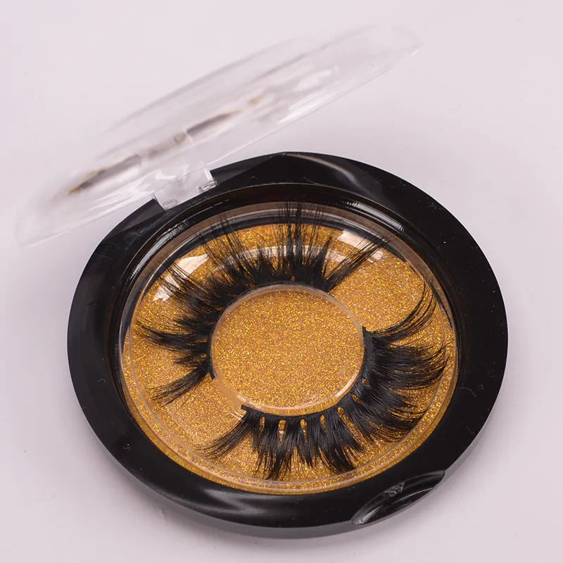 5D mink false eyelashes set with hair cap and double-headed brush on a white background.