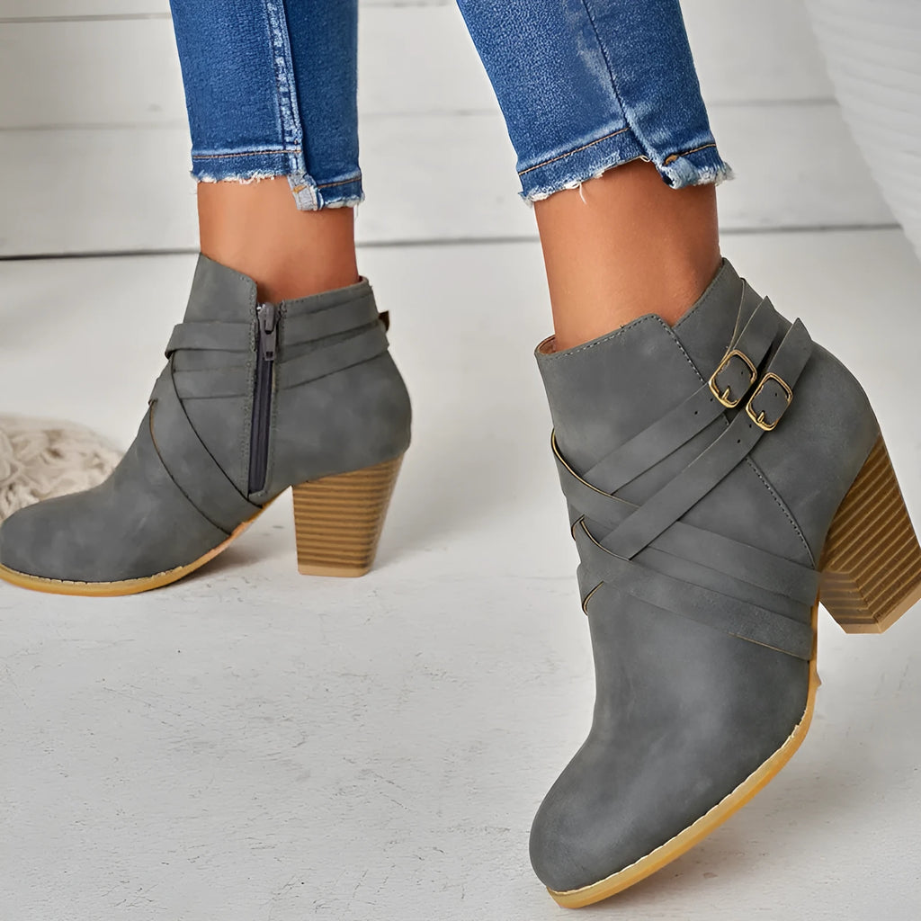 Plus size black short boot with side zipper, belt buckle, and a 7cm rubber heel