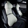 Beige and black car neck pillow and matching lumbar support pillow with wavy pattern.