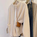 Beige women's cardigan-style sweater coat with long sleeves made from soft viscose.