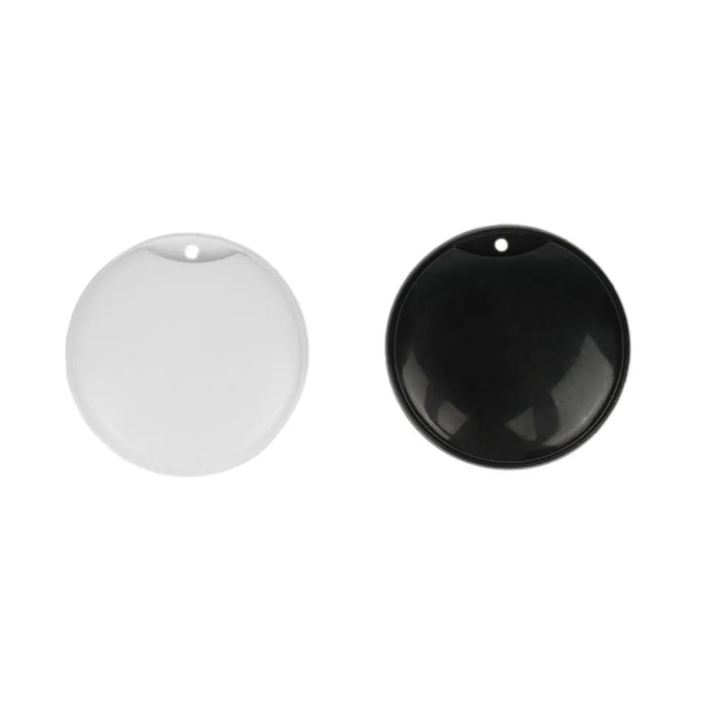 White and black GPS tracker for pets and keys with hanging rope attachment