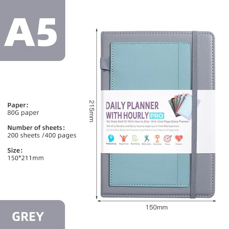 A5 notebook with PU leather cover in matcha green, lying open on a desk