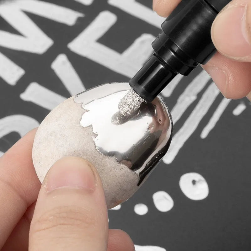 Waterproof mirror marker pen with plastic shell, shown with 1mm and 2mm tip options for glass writing.