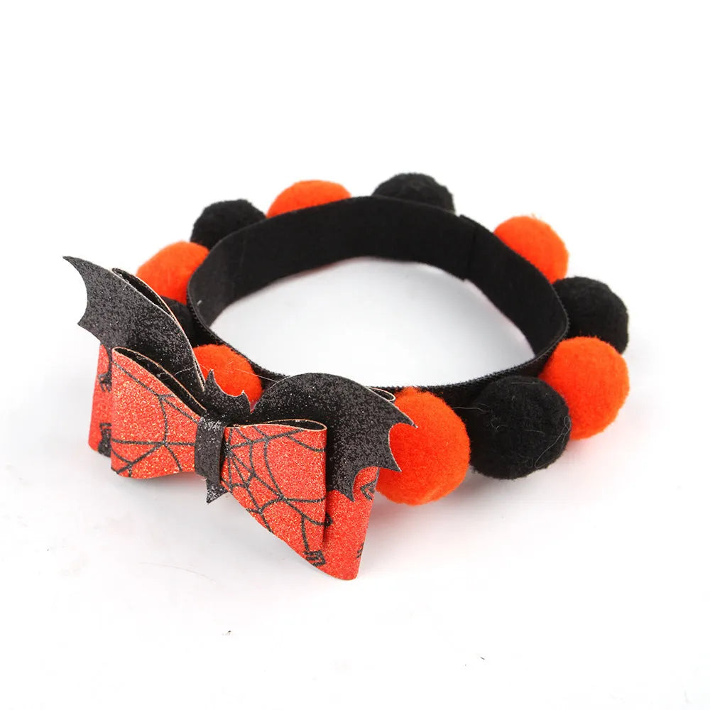 Halloween pet collar with fur ball decoration in pumpkin design on dog neck