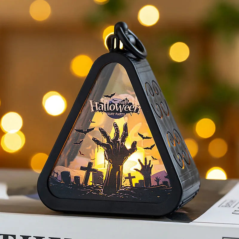 Halloween pumpkin lantern decoration in four colour designs on a table.