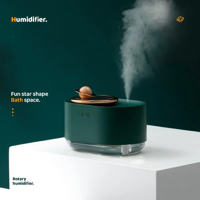 Rotating planet humidifier with night light in green, pink, or white colours showing USB port and mist output
