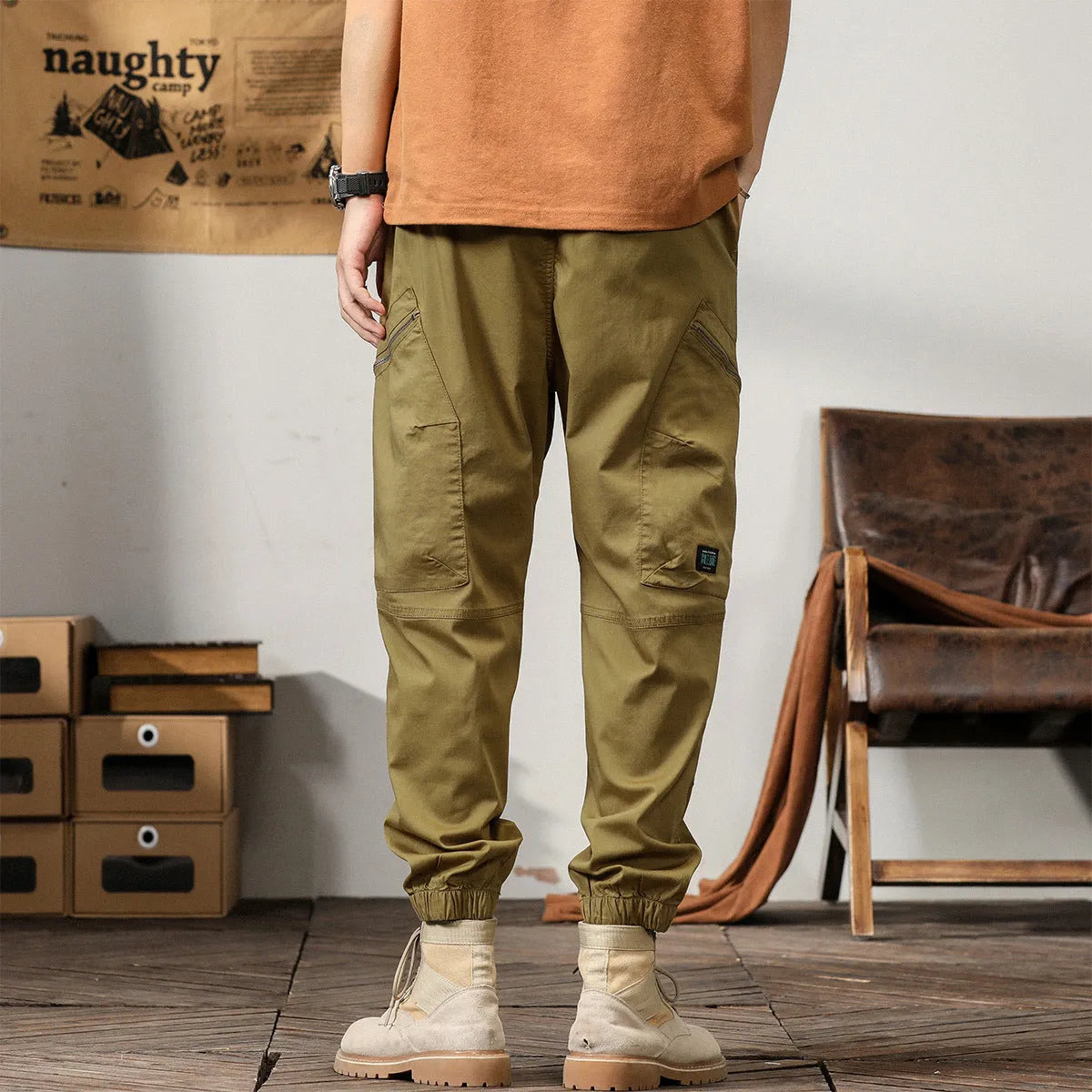 Men's tapered harem trousers in cotton with ankle band and zip placket front