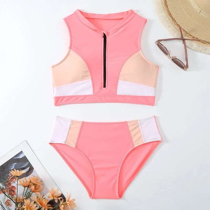 Pink high-waisted bikini set with sleeveless top and shorts on a mannequin