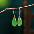 Chinese style geometric earrings with jade colour finish and water droplet design elements