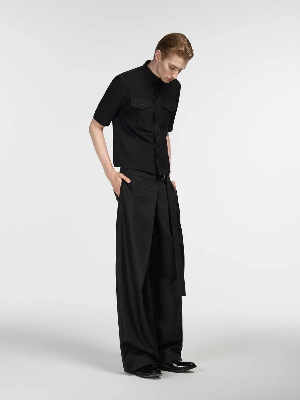 Black straight-leg trousers with adjustable waistband and single pleated front detail