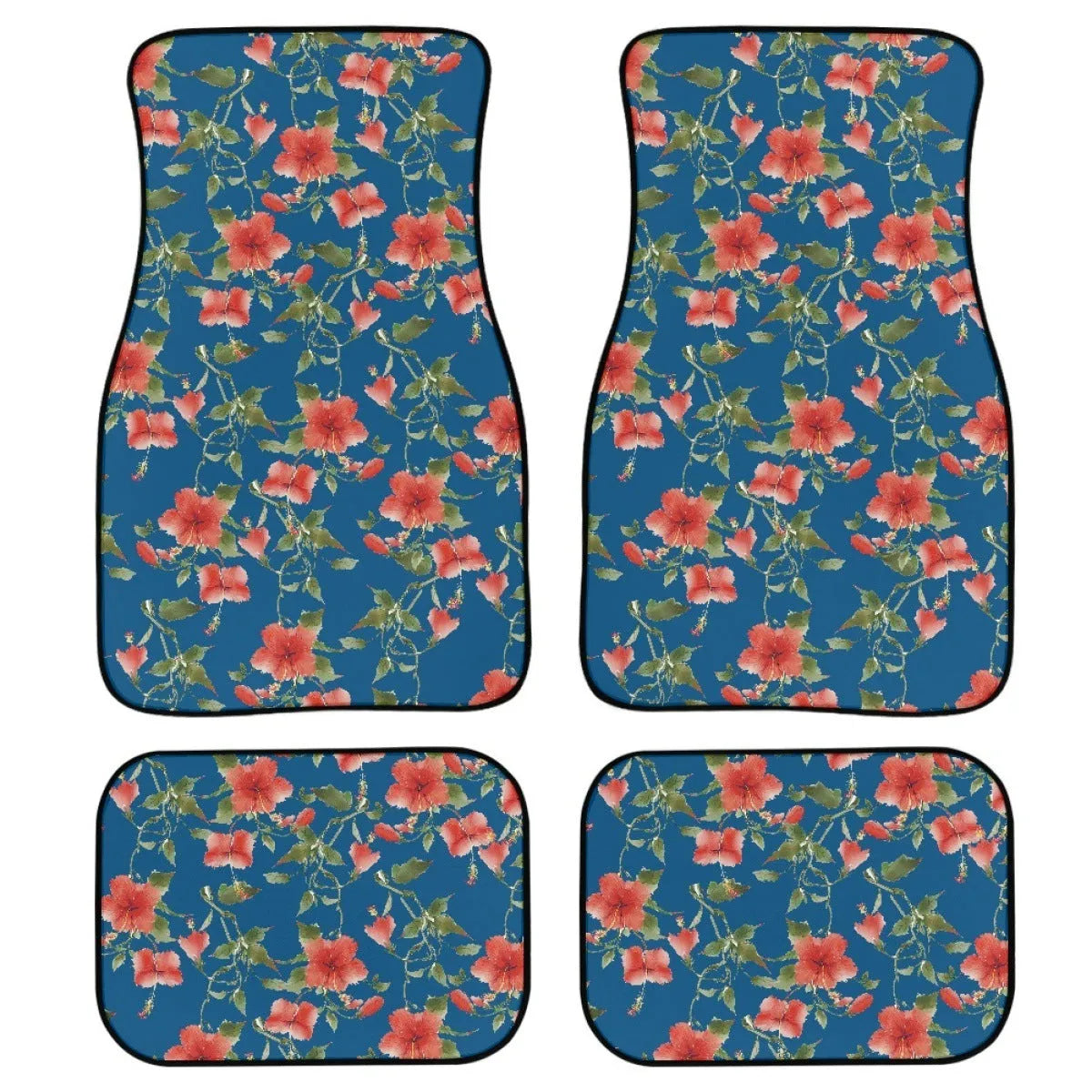 Set of four black rubber car floor mats with a textured surface and raised edges, shown in a vehicle footwell.