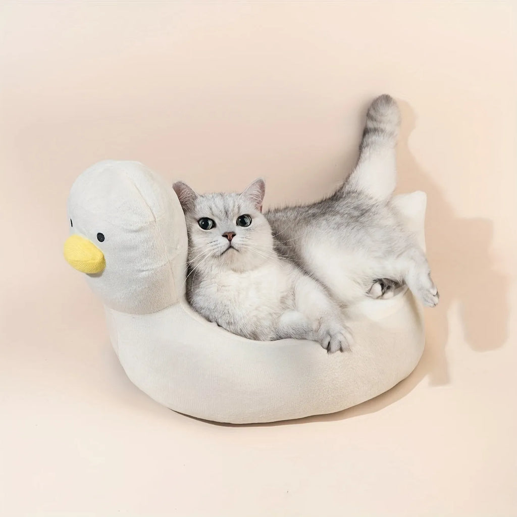 Blue duck-shaped fluffy pet bed sofa for small dogs and cats on wooden floor