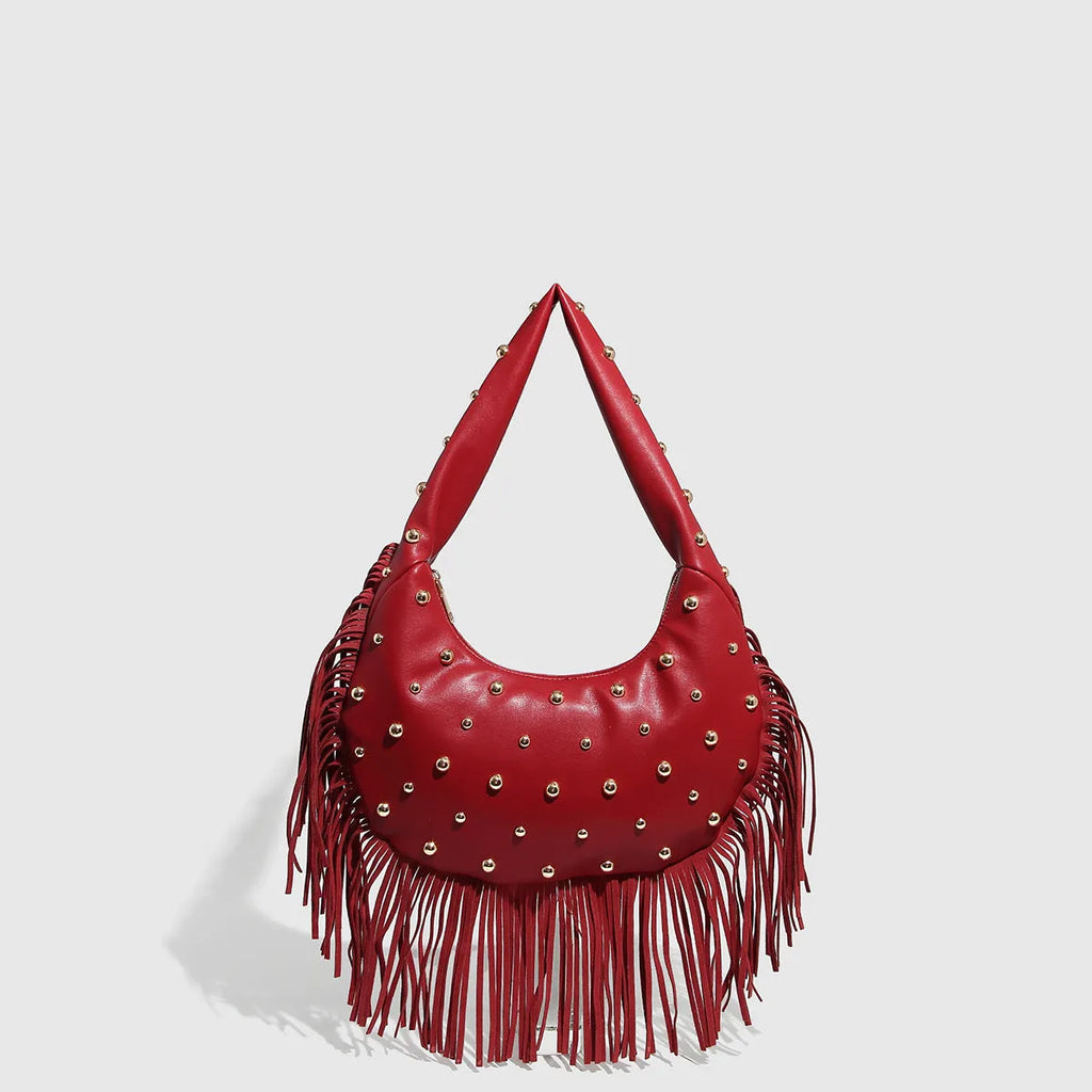 Retro black shoulder handbag with a gold tassel detail and structured shape.