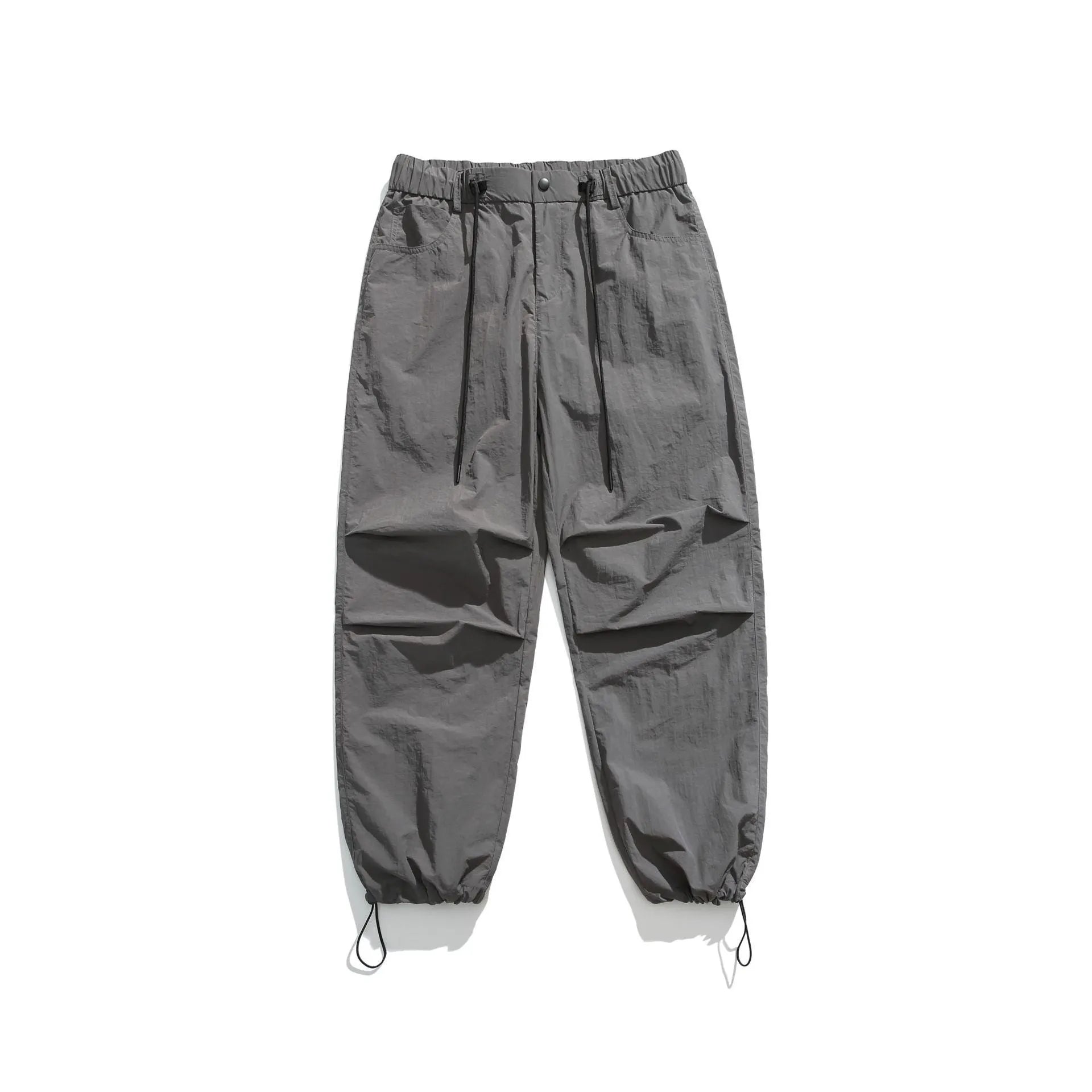 Men's loose straight-leg casual trousers in thin ice silk nylon fabric, shown in apricot colour.