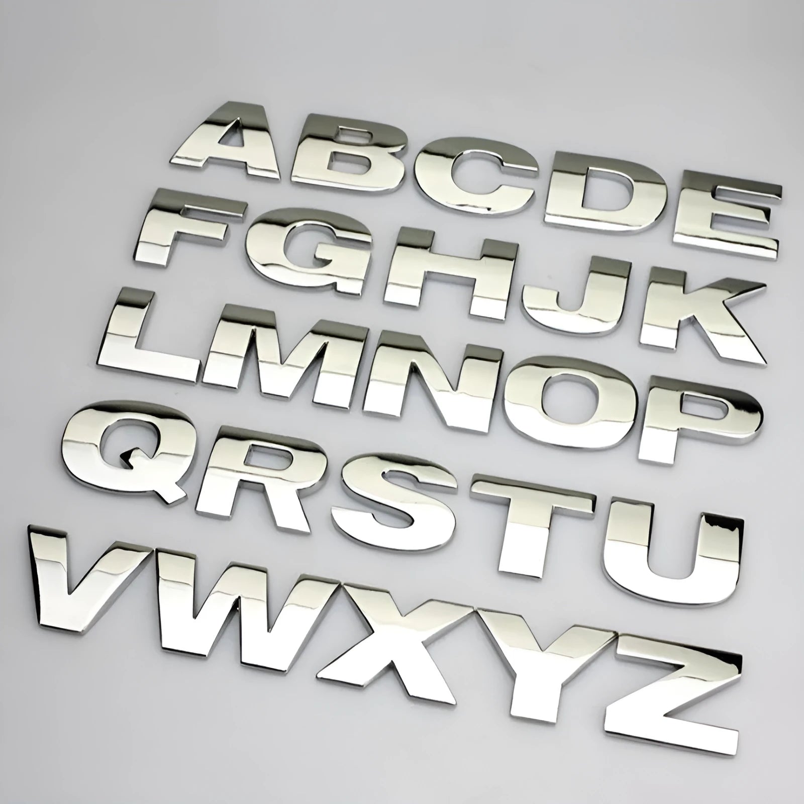 Zinc alloy metal car sticker with 3D raised English letter measuring 2.5cm in black finish