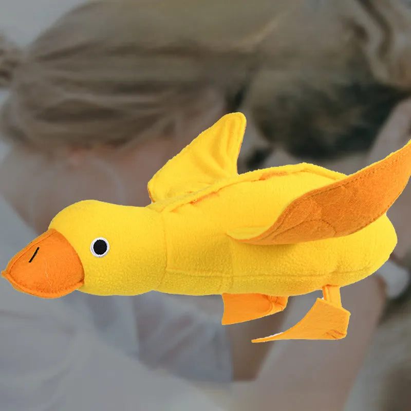Yellow teddy duck dog toy with squeaker and treat compartment for training and dental care