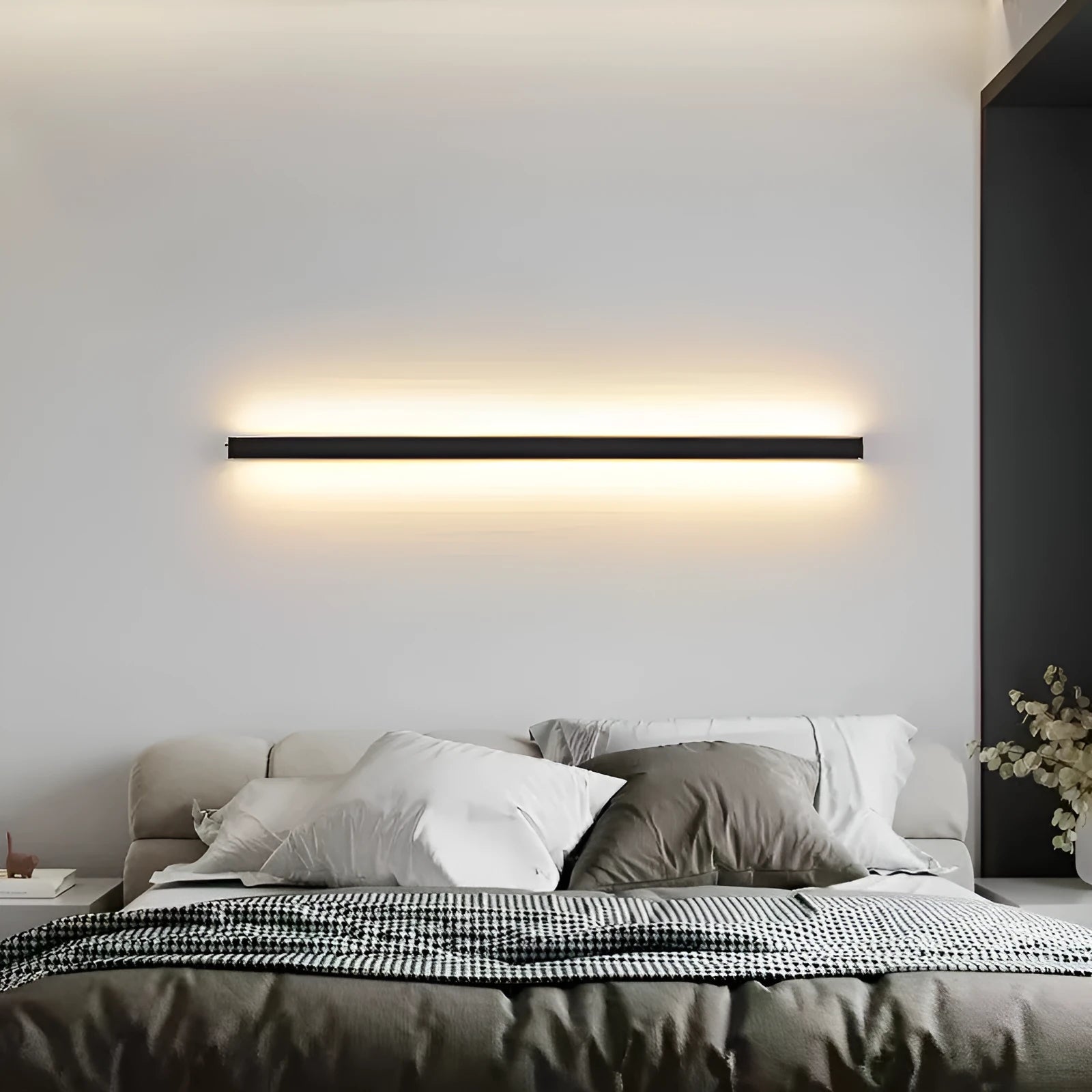 80cm long black linear LED wall lamp with touch control for three light colours on a plain wall.