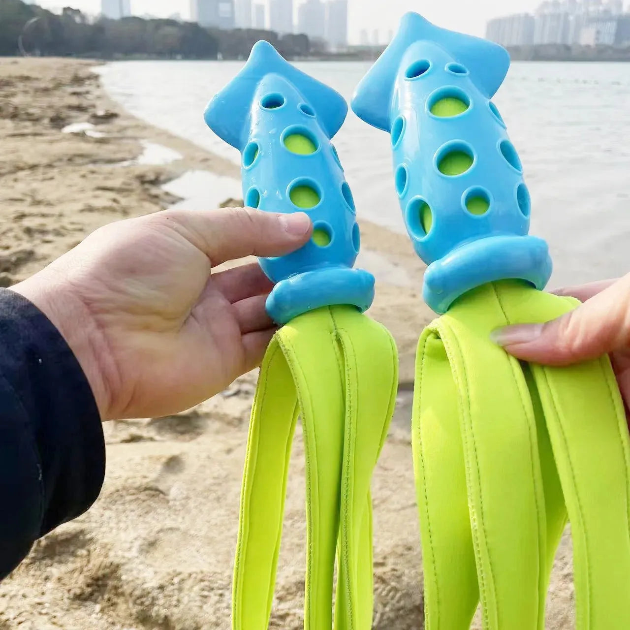 Blue cuttlefish-shaped dog chew toy with textured surface and squeaker for teeth cleaning