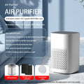 Compact desktop air purifier with USB cable connection and simple modern design