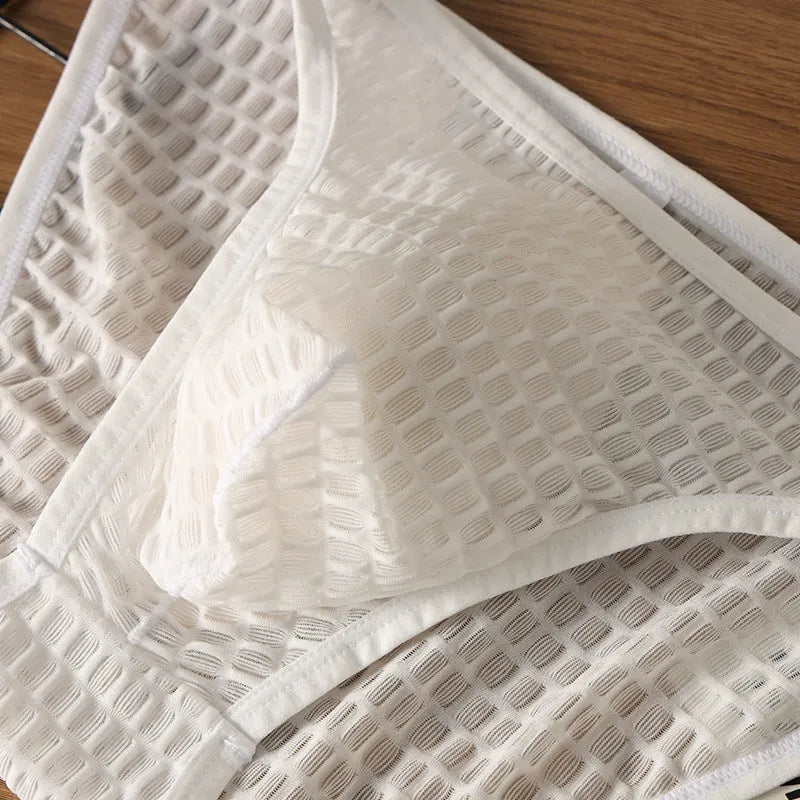 Men's low waist transparent visual lace underwear in multiple colours on a size chart