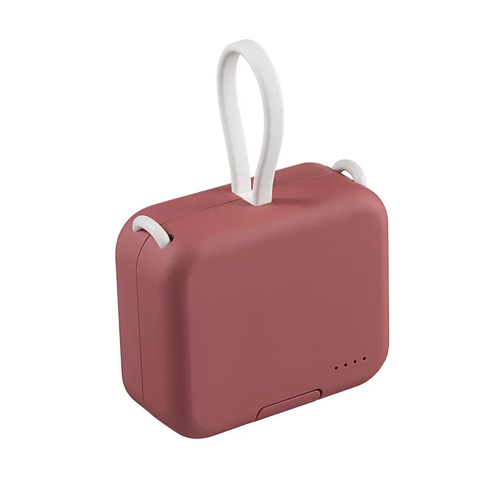 Multi-function bracket mobile power supply in red, green, or purple showing dual charging ports and integrated phone stand.