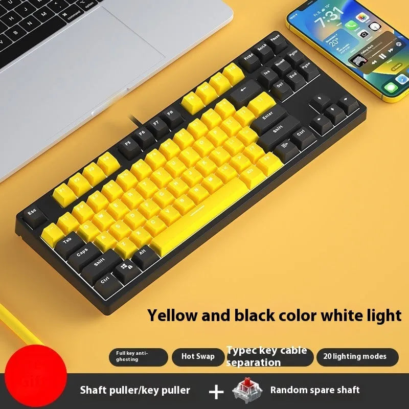 87-key wired mechanical keyboard with two-tone keycaps, shown with switch puller and cleaning brush