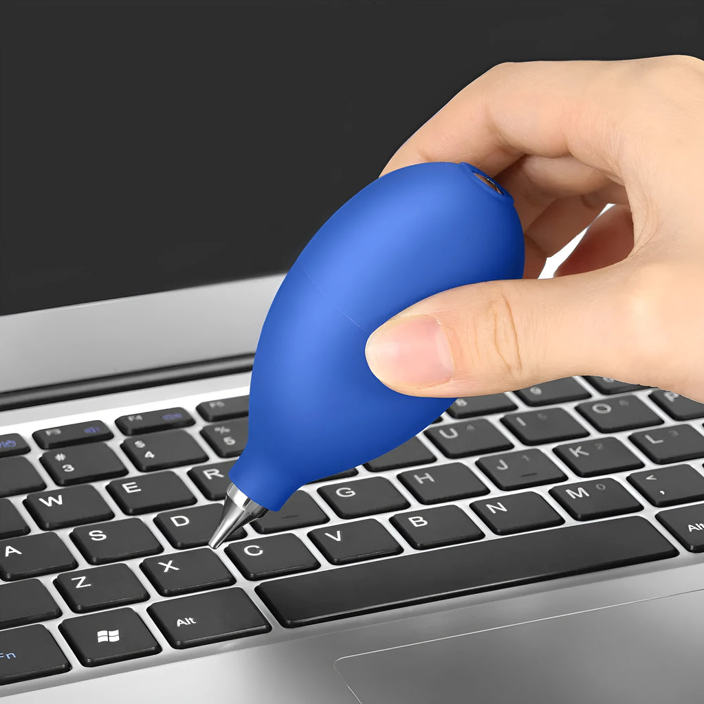 Blue handheld rubber dust blower cleaning tool for camera lenses and mobile phones.