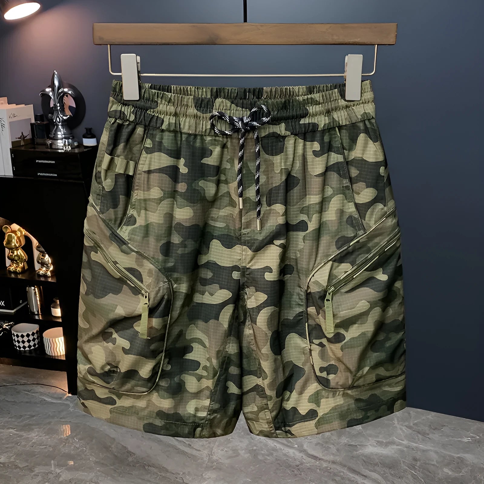 Man wearing loose-fit camouflage cargo shorts with cargo pockets and an elasticated waistband.