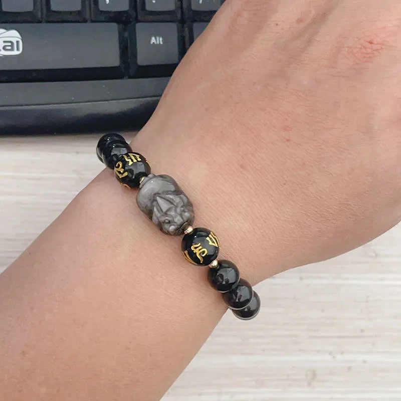 Men's silverstone bracelet with beadwork featuring Chinese proverbs, on a wrist.