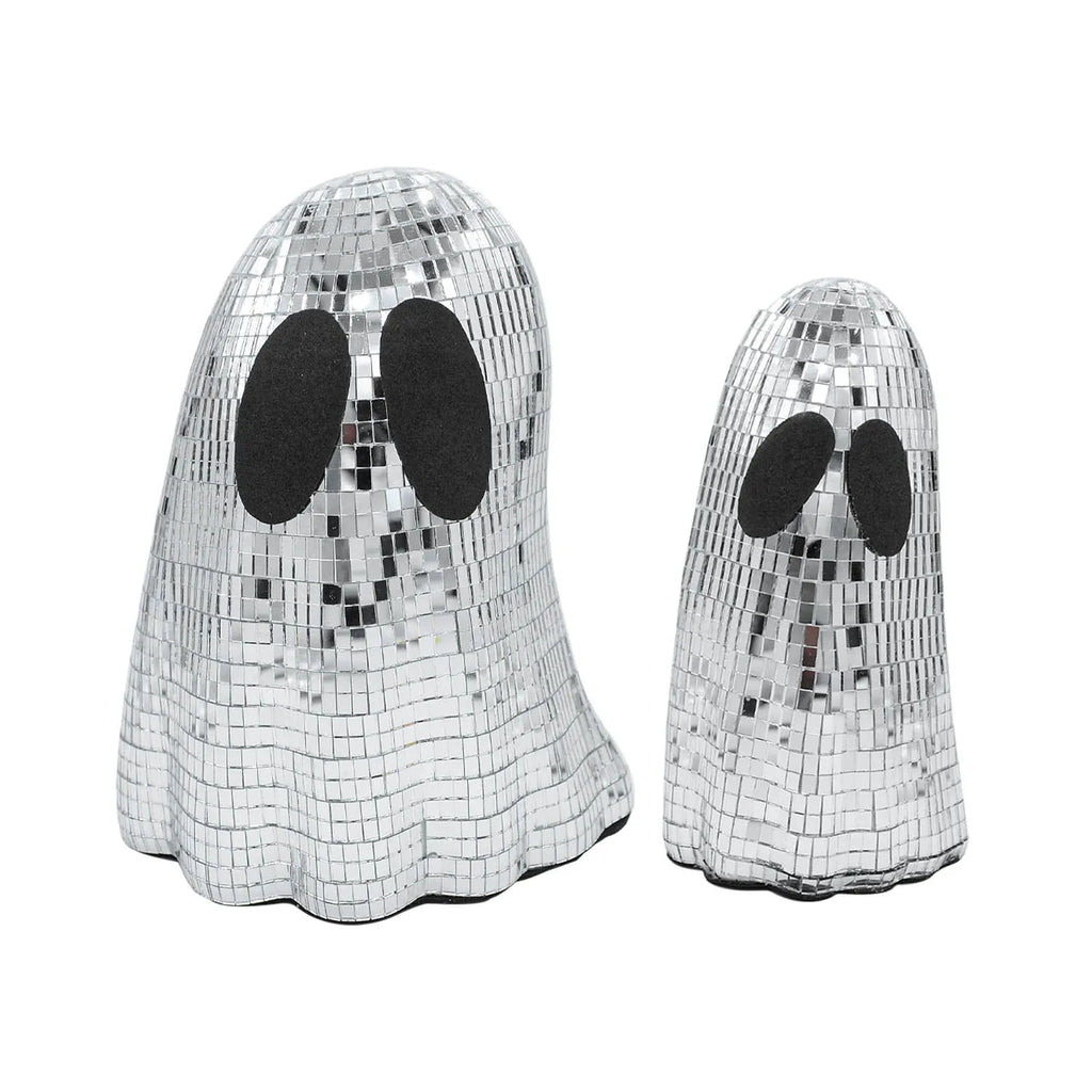 Silver glass Halloween ghost decoration with mosaic mirror patch design on a desktop.