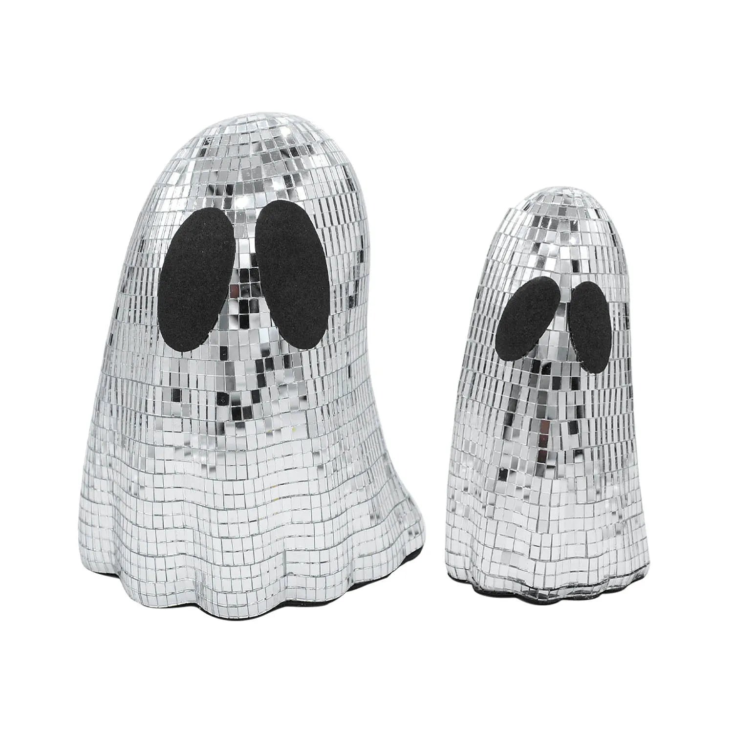 Silver glass Halloween ghost decoration with mosaic mirror patch design on a desktop.