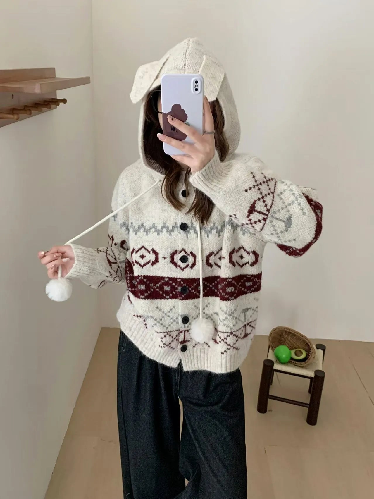 A beige, loose-fitting brocade knit sweater coat for plus size women with a geometric pattern.