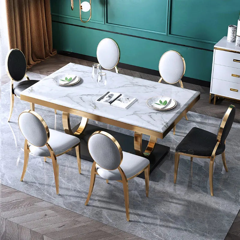 Rectangle slate dining table with marble finish and metal frame, shown with pineapple or round-back chairs