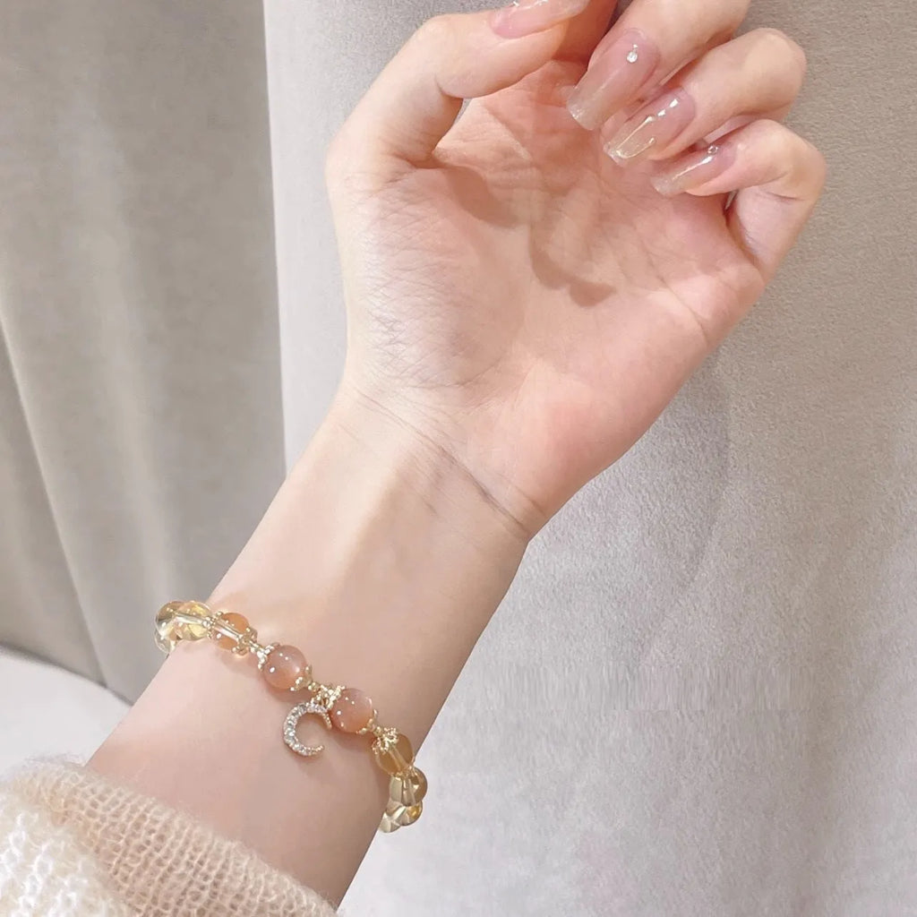 Chinese style women's crystal bracelet with diamond shaped stones and electroplated 14K gold gilded finish in citrine moon colour