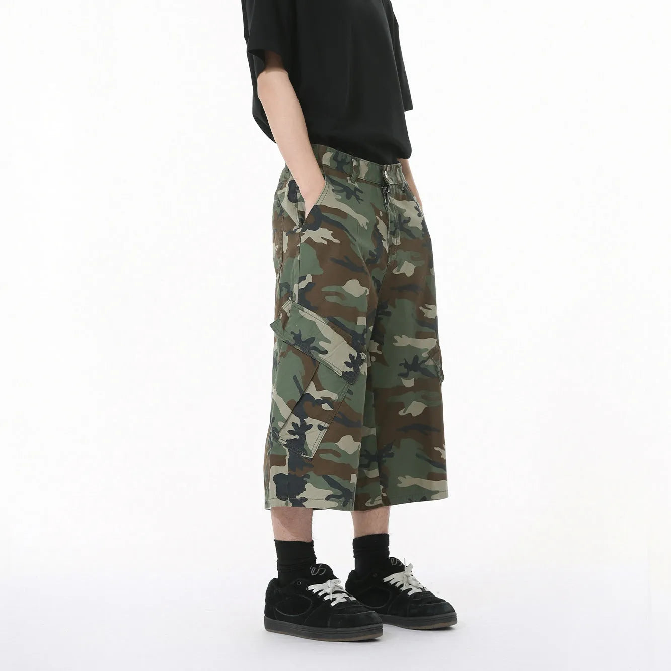 Men's camouflage print cotton jeans with a wide leg, cropped length, and large front pockets.