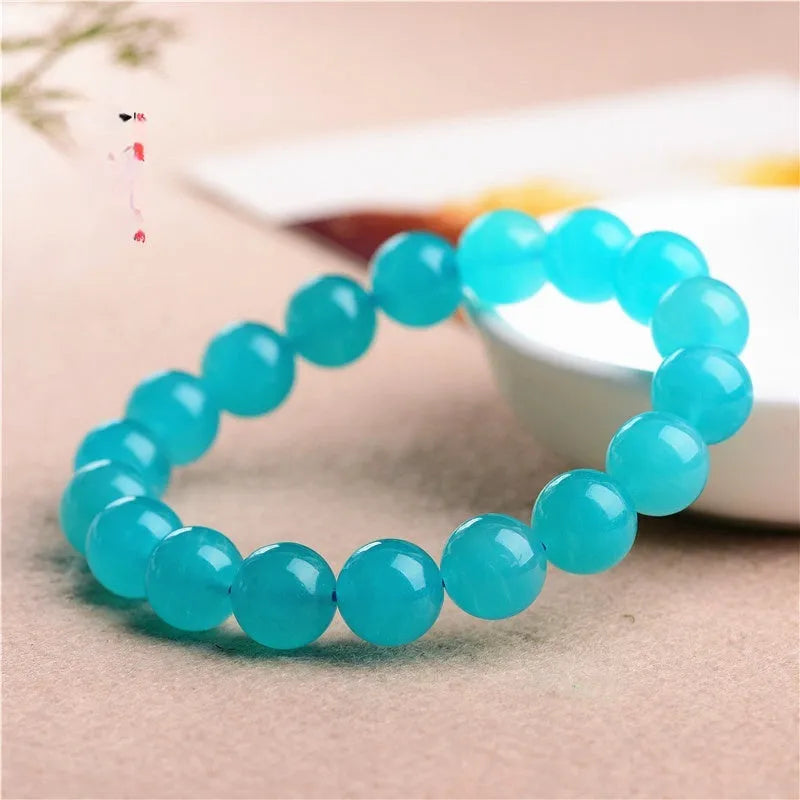 Natural Grade 7A Amazonite scattered beads in ice colour, showing polished surfaces and multiple size options for jewellery making.