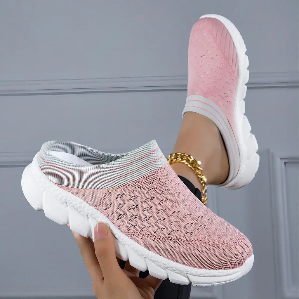 Women's black, pink, and purple Flyknit semi-slipper shoes with striped pattern and hollowed-out design.
