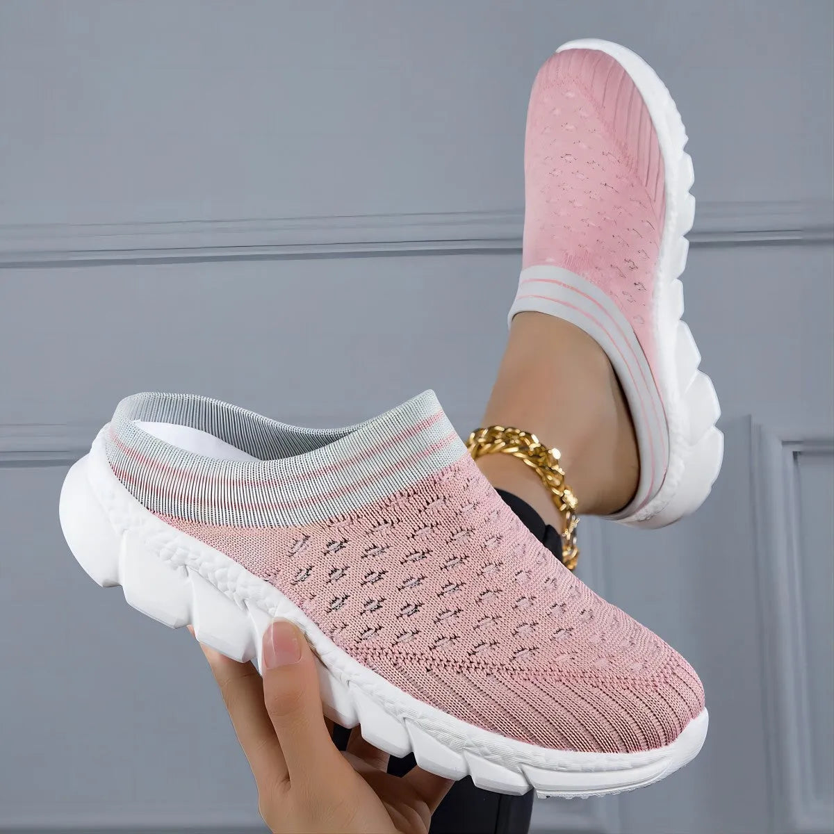 Women's black, pink, and purple Flyknit semi-slipper shoes with striped pattern and hollowed-out design.