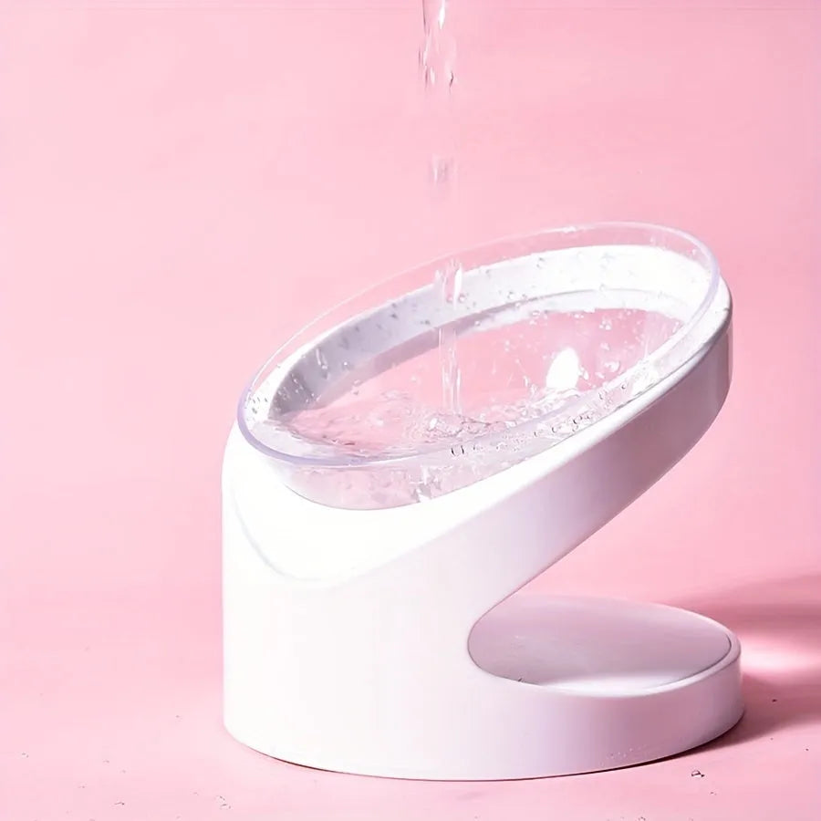 White clear plastic elevated cat food bowl with anti-vomit tilt design on stable base