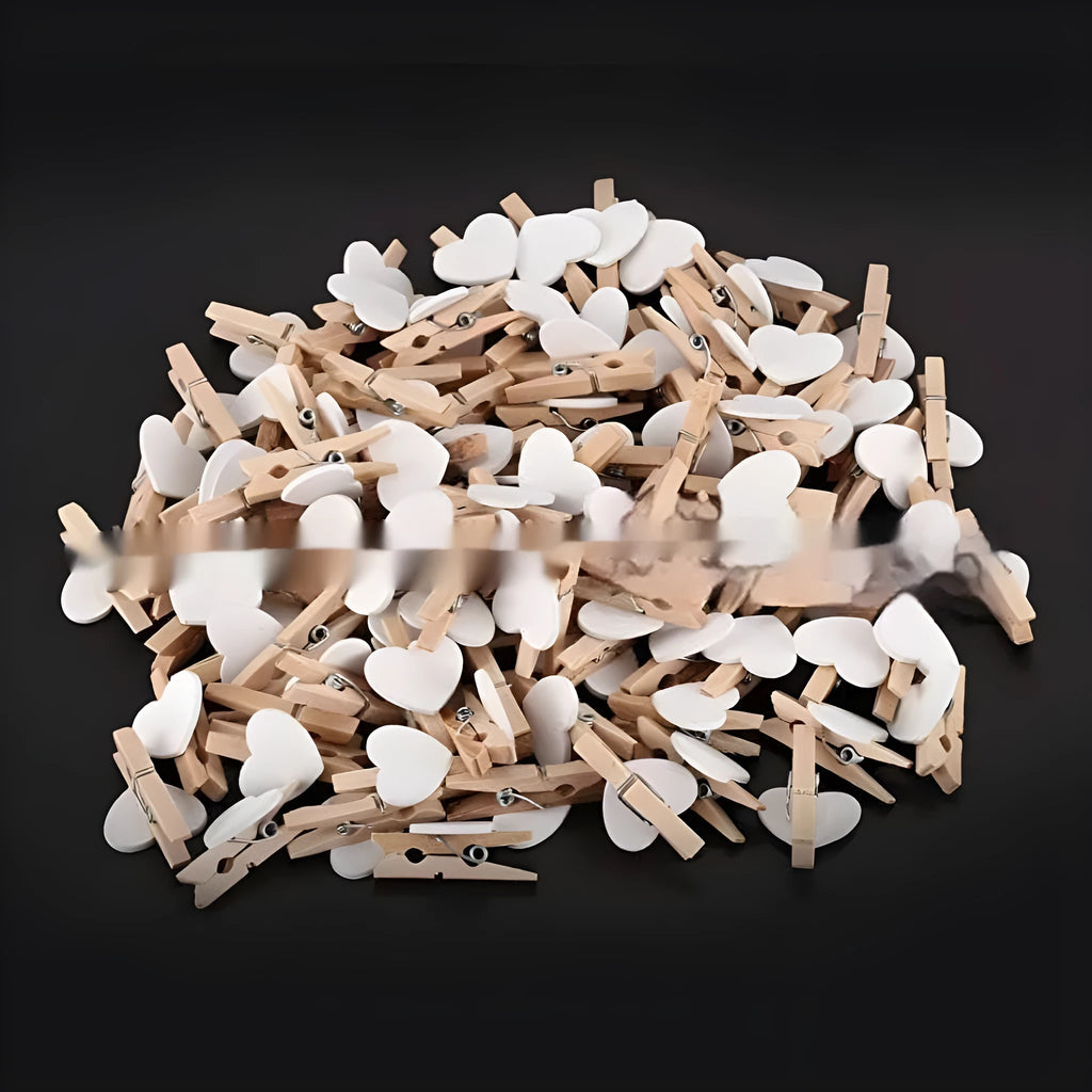 Set of five solid wood heart-shaped hair clips in red, white, and rose red on a plain background.