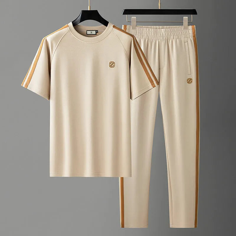 Men's blue short sleeve polyester sport suit set with matching trousers