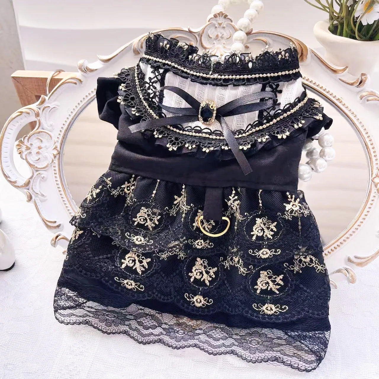 Golden gothic-style skirt for a small dog or cat on a mannequin, showing princess design.