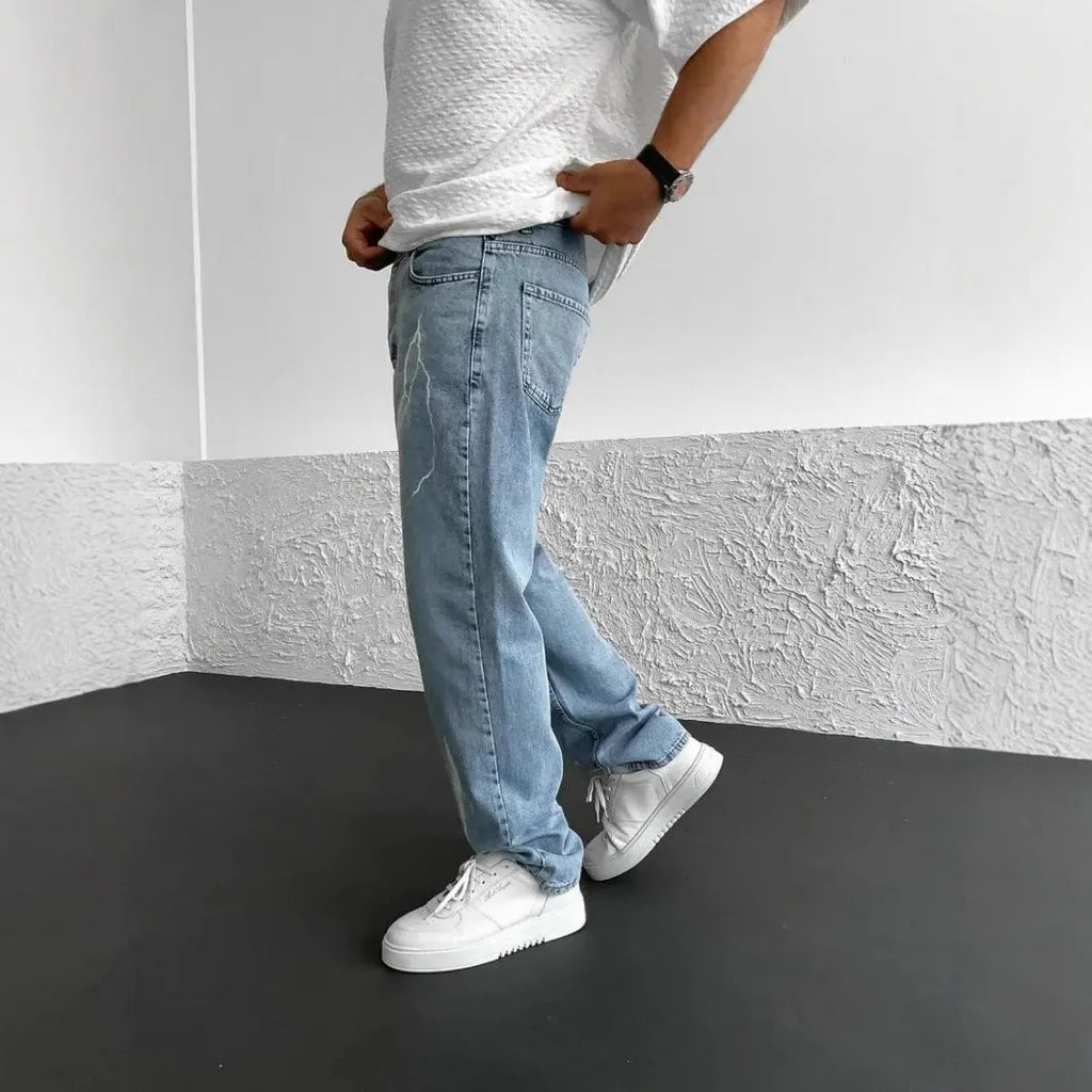 Men's blue straight-leg denim trousers with mid waist and zipper fly closure